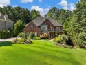 This EXQUISITE CUSTOM ESTATE in Suwanee's prestigious for sale in Suwanee Georgia Gwinnett County County on GolfHomes.com