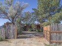 Discover unparalleled beauty and comfort in this exquisite for sale in El Prado New Mexico Taos County County on GolfHomes.com