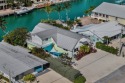 Experience the ultimate in Florida Keys living with this coveted for sale in Key Colony Beach Florida Monroe County County on GolfHomes.com