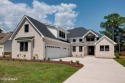 Nestled in a private cul-de-sac within the prestigious brick for sale in Hampstead North Carolina Pender County County on GolfHomes.com