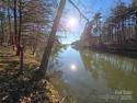 This Badin Lake waterfront lot is located in the prestigious for sale in Badin Lake North Carolina Montgomery County County on GolfHomes.com