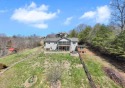 Welcome to your next home.  This 4 bedroom, 3 bath residence is for sale in Hayesville North Carolina Clay County County on GolfHomes.com