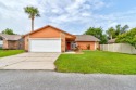 Step inside this beautifully updated 3-bedroom, 2-bath, 2-car for sale in Daytona Beach Florida Volusia County County on GolfHomes.com