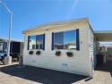 Welcome home to one of Long Beach's highly sought after senior for sale in Long Beach California Los Angeles County County on GolfHomes.com