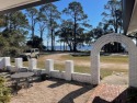 Enjoy waterfront views at this Coastal cottage located minutes for sale in Carabelle Florida Franklin County County on GolfHomes.com