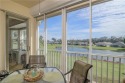 Pristine END UNIT overlooking a tranquil pond with clusters of for sale in Estero Florida Lee County County on GolfHomes.com