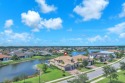 This stunning waterfront home, situated on a rare, ultra-premium for sale in Jupiter Florida Palm Beach County County on GolfHomes.com
