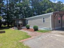 Golf cart distance to the ocean, grocery store and restaurants for sale in Murrells Inlet South Carolina Horry County County on GolfHomes.com