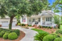 Nestled on a quiet street in the prestigious gated community of for sale in Pawleys Island South Carolina Georgetown County County on GolfHomes.com