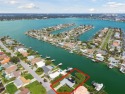 TOP WATERFRONT LOCATION ON AN OVERSIZED 100' WATERFRONT LOT WITH for sale in Treasure Island Florida Pinellas County County on GolfHomes.com