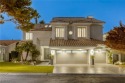 Floor-to-ceiling windows frame the lush greens of the 7th hole for sale in Las Vegas Nevada Clark County County on GolfHomes.com