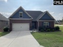 This beautiful brick Stapleton in Club Ridge at Woodcreek Farms for sale in Elgin South Carolina Richland County County on GolfHomes.com