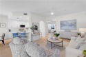 LIVE A VACATION LIFESTYLE IN THE QUARRY! This BETTER THAN NEW for sale in Naples Florida Collier County County on GolfHomes.com