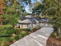 Tucked away on a private cul-de-sac surrounded by mature trees for sale in Gainesville Florida Alachua County County on GolfHomes.com