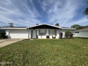 Experience Florida living with a tranquil setting in this for sale in Daytona Beach Florida Volusia County County on GolfHomes.com