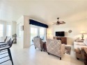 Beautiful 2 BR/2 Bath Condo w/ GOLF MEMBERSHIP.  Bright & for sale in Naples Florida Collier County County on GolfHomes.com