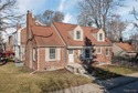 Welcome Home ! This brick bungalow offers an oversized primary for sale in Grosse Pointe Woods Michigan Wayne County County on GolfHomes.com