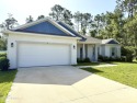 Experience refined, single-story living in this spacious 2,338 for sale in Palm Coast Florida Flagler County County on GolfHomes.com