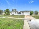 One or more photo(s) has been virtually staged. Modern style for sale in Port Charlotte Florida Charlotte County County on GolfHomes.com