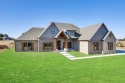 Stunning New Construction ( previously a model home) on .74 for sale in Claremore Oklahoma Rogers County County on GolfHomes.com