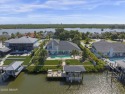Discover a rare opportunity to own a custom-renovated luxury for sale in New Smyrna Beach Florida Volusia County County on GolfHomes.com