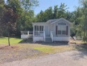 This two bedroom, 1.5 half bath Park Model is located in highly for sale in Casco Maine Cumberland County County on GolfHomes.com