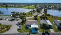 This amazing TRIPLE-wide Palm Harbor home is situated on a for sale in Port Charlotte Florida Charlotte County County on GolfHomes.com