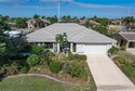 WATERFRONT HOME IN PGI W/**NEW TILE ROOF** & NEARLY INSTANT for sale in Punta Gorda Florida Charlotte County County on GolfHomes.com