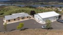 **Stunning Three-Bedroom Home on Lake Roosevelt!**  Discover for sale in Deer Meadows Washington Lincoln County County on GolfHomes.com