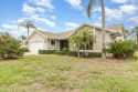 Located in a military country club, this expanded Austin model for sale in Melbourne Florida Brevard County County on GolfHomes.com