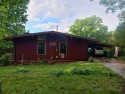 Spectacular view!! This 2/2 home on 2+ acres sits on a bluff for sale in Cherokee Village Arkansas Sharp County County on GolfHomes.com