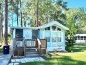This 2-bedroom home is in an ALL-AGE COMMUNITY! It has a large for sale in Clermont Florida Lake County County on GolfHomes.com