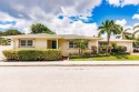 Experience coastal farmhouse charm in the highly sought-after for sale in Lake Worth Beach Florida Palm Beach County County on GolfHomes.com