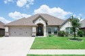This exquisite four bedroom three bath Al Couto home boasts for sale in Granbury Texas Hood County County on GolfHomes.com