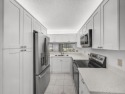 Rarely Available First Floor End Unit with views of the 7th hole for sale in Jupiter Florida Palm Beach County County on GolfHomes.com