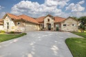 Impeccable Mediterranean style home in the highly coveted, gated for sale in Granbury Texas Hood County County on GolfHomes.com