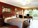 Highly sought-after *King* model with impact windows  accordion for sale in Pompano Beach Florida Broward County County on GolfHomes.com