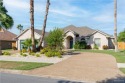 Explore this stunning home in the gated SPI Golf Community--a for sale in Laguna Vista Texas Cameron County County on GolfHomes.com