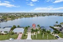 Stunning Lakefront Luxury Home on Lake Saratoga. Welcome to this for sale in Cape Coral Florida Lee County County on GolfHomes.com