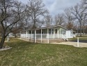 Newly renovated cottage with modern updated appliances & wood for sale in Baldwin Michigan Lake County County on GolfHomes.com