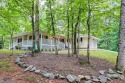 Nestled in Burton Getaways Community, this charming Fee Simple for sale in Clayton Georgia Rabun County County on GolfHomes.com