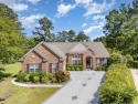WOW, THIS HOME HAS IT ALL! Located on the widest lot, on a pond for sale in Murrells Inlet South Carolina Horry County County on GolfHomes.com