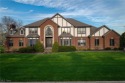 Nestled on the 5th hole of Barrington Golf Course, this brick for sale in Aurora Ohio Portage County County on GolfHomes.com