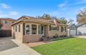 Discover warmth and comfort with this beautifully upgraded pool for sale in Lakewood California Los Angeles County County on GolfHomes.com