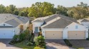 Nestled amongst the 14th Green of Mystic Dunes Golf and Country for sale in Kissimmee Florida Osceola County County on GolfHomes.com