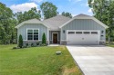 Built in 2024, this home sits on .29 acre lot minutes from I49 for sale in Bella Vista Arkansas Benton County County on GolfHomes.com