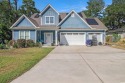 This is a beautiful, custom-built 5-bedroom, 3.5-bath home just for sale in Surfside Beach South Carolina Horry County County on GolfHomes.com
