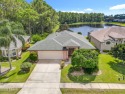 Welcome to your dream home, nestled gracefully on the serene for sale in Port Orange Florida Volusia County County on GolfHomes.com