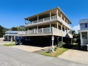 CUSTOM BUILT OCEAN VIEW KEY WEST BEACH HOUSE WITH WRAPAROUND for sale in Myrtle Beach South Carolina Horry County County on GolfHomes.com