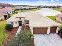 Captivating WATER VIEWS greet you upon entering this impressive for sale in Kissimmee Florida Polk County County on GolfHomes.com